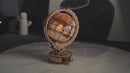 Atmospheric video of the Robotime Luminous Globe, mechanical wooden model kit of an illuminated globe
