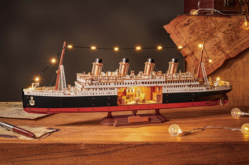Atmospheric presentation of the Robotime 1912 - Eternal Atlantic Voyager, wooden model of a vintage steamship with a cutout in the hull revealing a retro interior