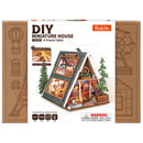 Front of package of the Robotime A-Frame Cabin, miniature vacation home in wintery Austrian style
