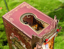 Detail of an opening in the shape of a keyhole on top of the Robotime Alice Adventure book nook