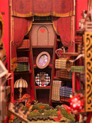 Detail of cabinets with books and decorations in the Robotime Alice Adventure book nook