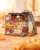 Atmospheric presentaion of the Robotime Baking Kitchen, surrounded by freshly baked bread