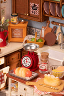 Details of a kicthen scale and baked goods of the Robotime Baking Kitchen