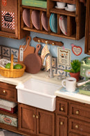 Detail of the kitchen counter and kitchen sink of the Robotime Baking Kitchen