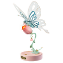 Product photo of the Robotime Butterfly (Pink), electric construction kit of a light blue butterfly that can flap its wings, on a pink flower