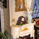 Details of the vintage clock, perfume bottle, and vase of flowers on the mantelpiece in Robotime Catherine's Living Room