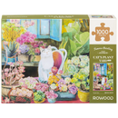 Front of package of the Robotime Cat’s Plant Yard, 1,000-piece jigsaw puzzle of a cat in a garden full of plants and flowers