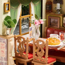 Seating and a set table with a view of the outdoors at the Robotime Champs-Élysées Bistro
