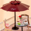 Details of the parasol, table and a chair of the Robotime Chic Café Terrace