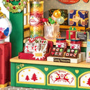 Details of the merchandise on the counter of the Robotime Christmas Candy Stand