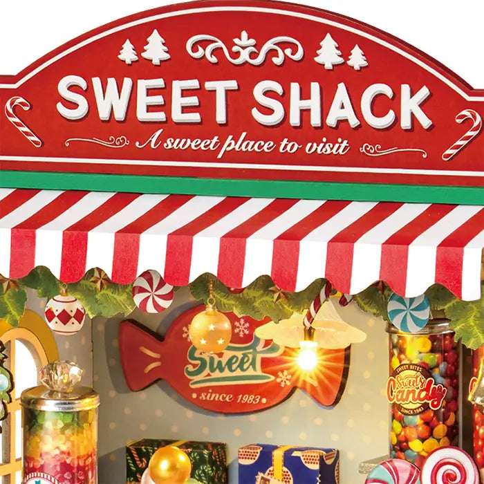 Close-up of the stall sign and awning of the Robotime Christmas Candy Stand
