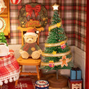 The decorated Christmas tree, teddy bear with Santa hat, and Christmas wreath in the Robotime Christmas Eve Party