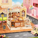 Atmospheric presentation of the Robotime Cookii Bunny’s Cookie Shop, miniature cookie shop with Cookii Bunny behind the counter