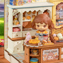 Cookii behind the counter at Robotime Cookii Bunny's Cookie Shop