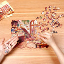 A person is putting the Robotime Cozy Winter Café jigsaw puzzle together