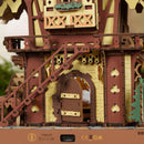 Close-up of the door and stairs on the back of the Robotime Cuckoo Clock