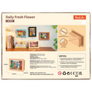 Back of package of the Robotime Daily Fresh Flower, diorama in a frame of an old-fashioned shop with flowers and plants