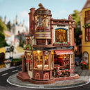 Atmospheric presentation of the Robotime Dream Coffee Factory, wooden construction kit of a cozy coffee factory with lights, sounds, and moving parts where coffee is served