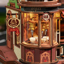 The machine that fills coffee cups down in the tower of the Robotime Dream Coffee Factory