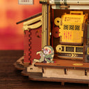 Detail of the packing machine and a Christmas elf of the Robotime Dream Gift Factory