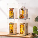 Four book nooks in Robotime Dust Covers WD1001 stacked on top of and next to each other