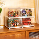 Examples of a wooden construction kit and miniature houses that fit in the Robotime Dust Cover Landscape S