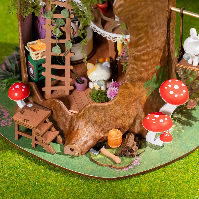 The bottom of the stump with mushrooms around it and the ground floor of the Robotime Fairytale Tree House