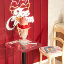 Close-up of the large coupe of strawberry ice cream with whipped cream on a table in the Robotime Flavorful Ice Cream