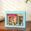 Atmospheric presentation of the Robotime Fluffy Cat Bakery, diorama in a frame of a small bakery with a cat