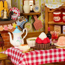 The set table in the kitchenette of the Robotime Fluffy Grove