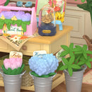 Close-up of various flowers and plants for sale in the Robotime Fresh Flower Shop