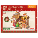 Front of package of the Robotime Gingerbread House, miniature house of a gingerbread house in Christmas theme