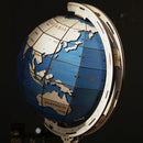 Atmospheric picture with a dark background of the Robotime Globe Super Size, mechanical wooden model kit of a big globe