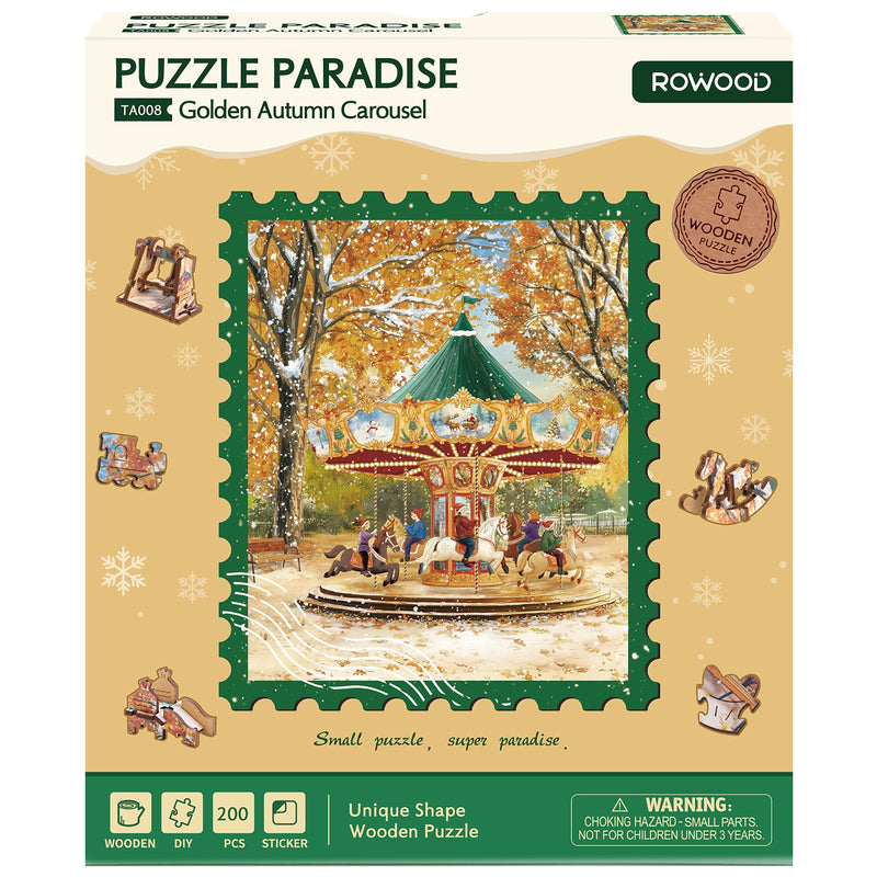 Front of package of the Robotime Golden Autumn Carousel, puzzle with pieces of unusual shape, depicting a vintage carousel on a snowy autumn day