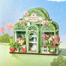 Atmospheric presentation of the Robotime Green Fountain Garden, construction kit for a miniature flower shop in an elegant greenhouse