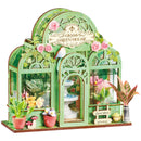 Product photo of the Robotime Green Fountain Garden, construction kit for a miniature flower shop in an elegant greenhouse