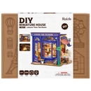 Front of package of the Robotime Leisure Time Tea Room, miniature house modeled after an old-fashioned tea room with a facade that opens