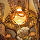 Close-up of the chandelier on the decorated ceiling of the Robotime Library of Wonders