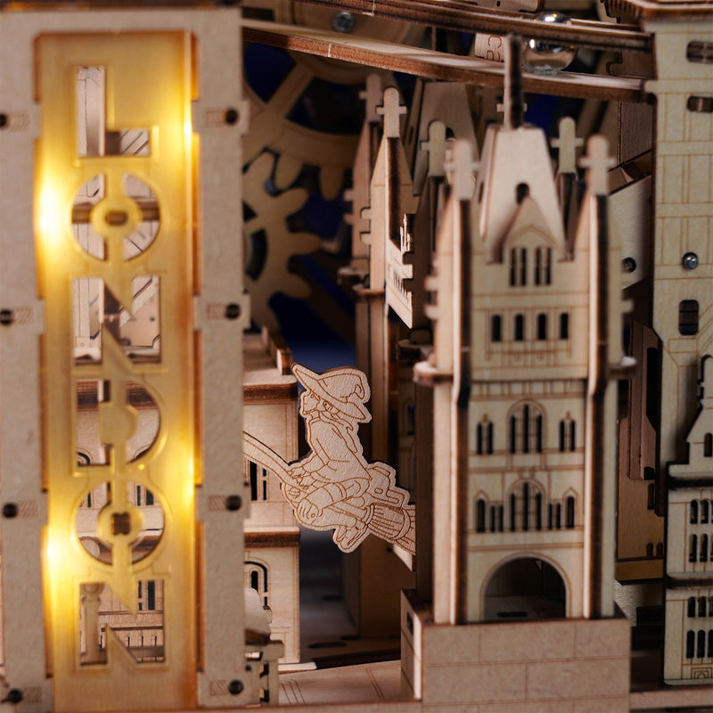 A witch flies close to the illuminated London sign in the Robotime London Sightseeing Walk