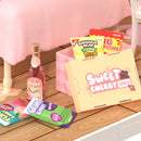 Close-up of the snacks and candy of the Robotime Lovely Pink Bedroom