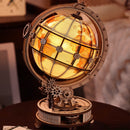 Atmospheric presentation of the Robotime Luminous Globe, electric, wooden construction kit for a rotating, illuminated globe