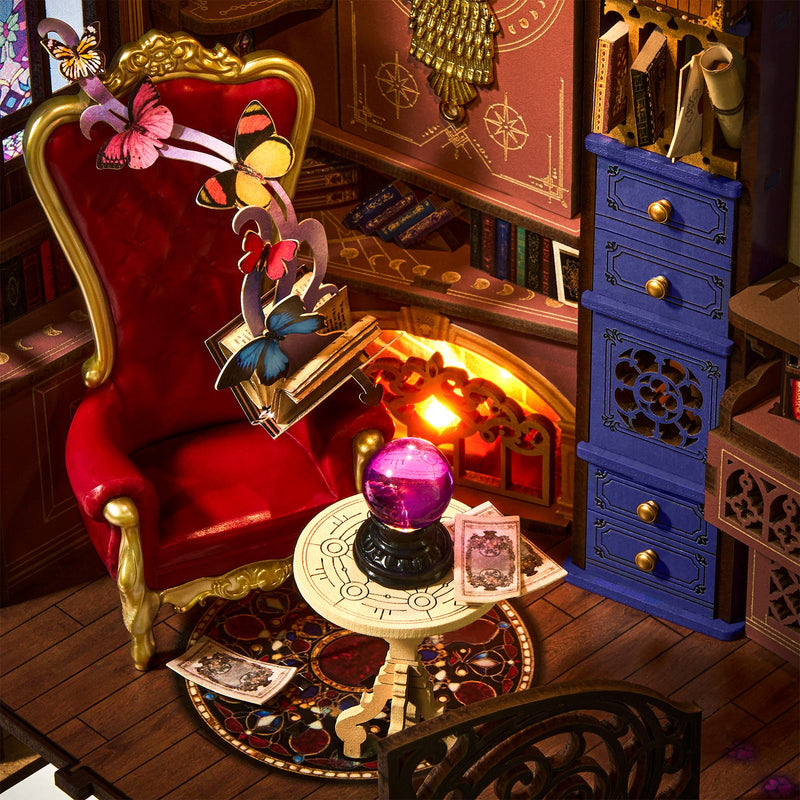 Cabinets, chair with magical book and table with crystal bal in the Robotime Magic Fantasy Corner