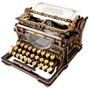 Product photo of the Robotime Mechanical Typewriter (Classic Version), wooden construction kit of a black and gold-colored, working typewriter