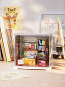 Atmospheric presentation of the Robotime Memory Book Store, plastic miniature bookstore in a small display case