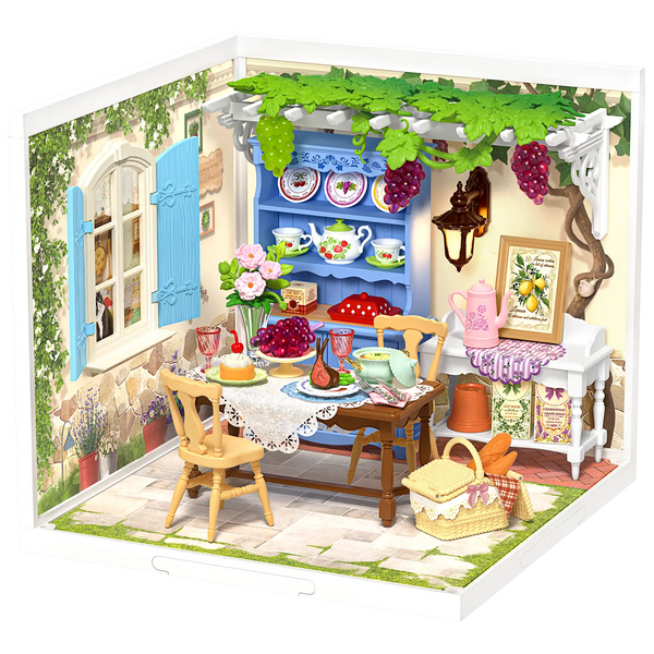 Product photo of the Robotime Midsummer Dream Yard, plastic miniature terrace with set table, pergola, and furniture