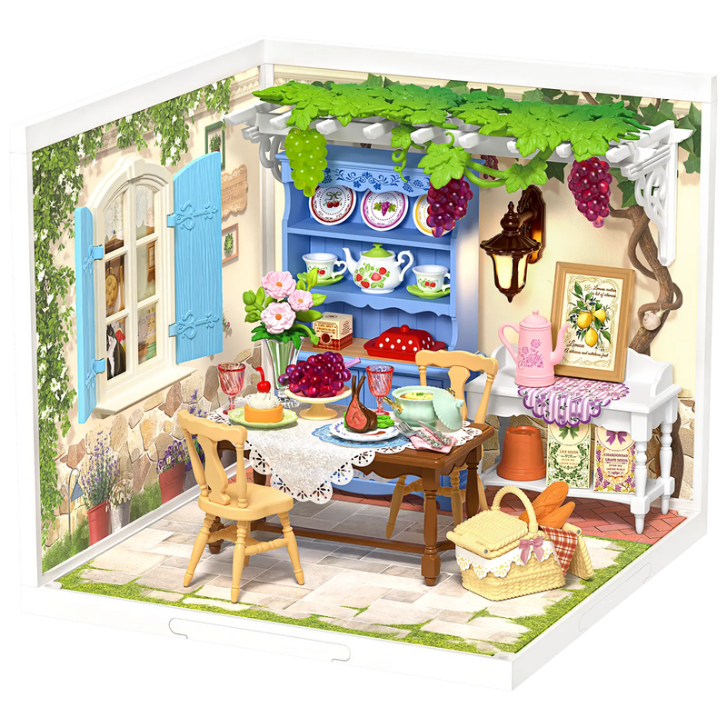 Product photo of the Robotime Midsummer Dream Yard, plastic miniature terrace with set table, pergola, and furniture