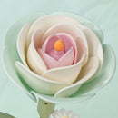 The soft green and pink flower of the Robotime Minty Camellia Lamp