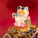 The Chill Life variant of the Robotime Nanci Best Wishes blind box series sitting on top of a pile of coins and jewels
