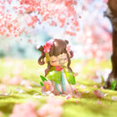 Adoration like Peach Blossom variant under a blossoming sakura tree