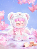 The rare, soft pink color variant of the Robotime Nanci Colorful Chocolate Cutie Bears, blind box with a cute figurine in a bear suit in multiple color variants